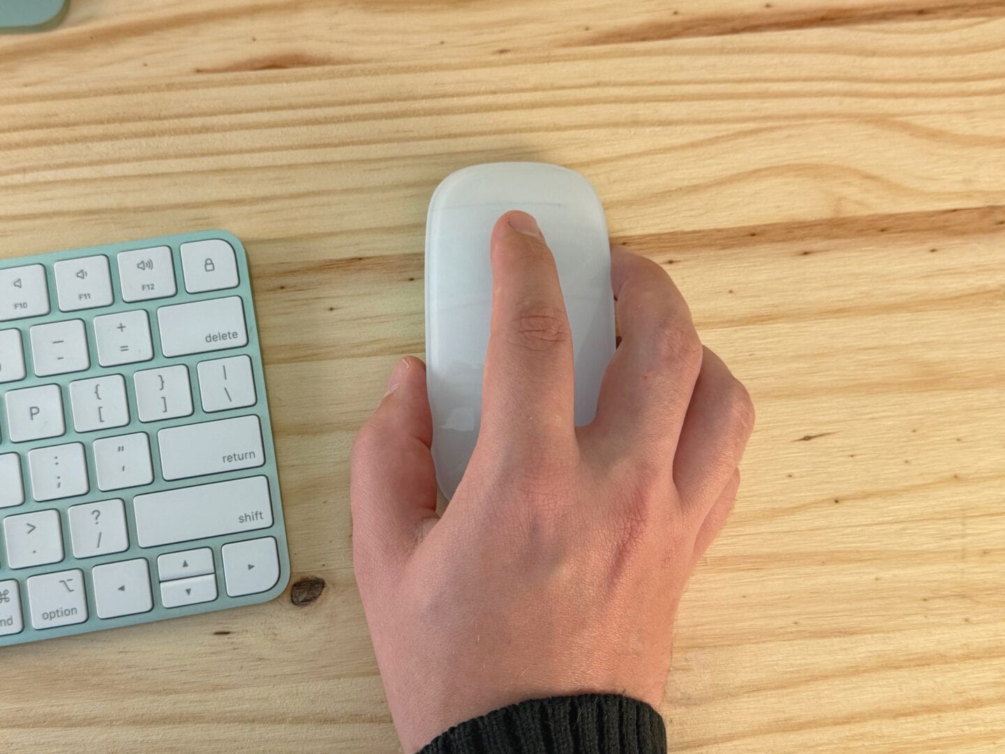 Holding White Magic Mouse Top Down Holding a Magic Mouse uncomfortably