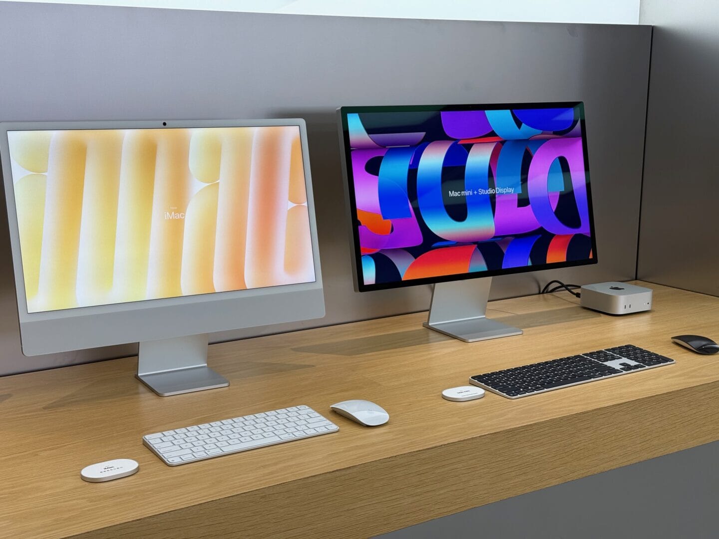 IMac M4 Silver with Mac mini and Studio Display Silver iMac next to a Mac Studio and Apple Studio Display in an Apple Store.