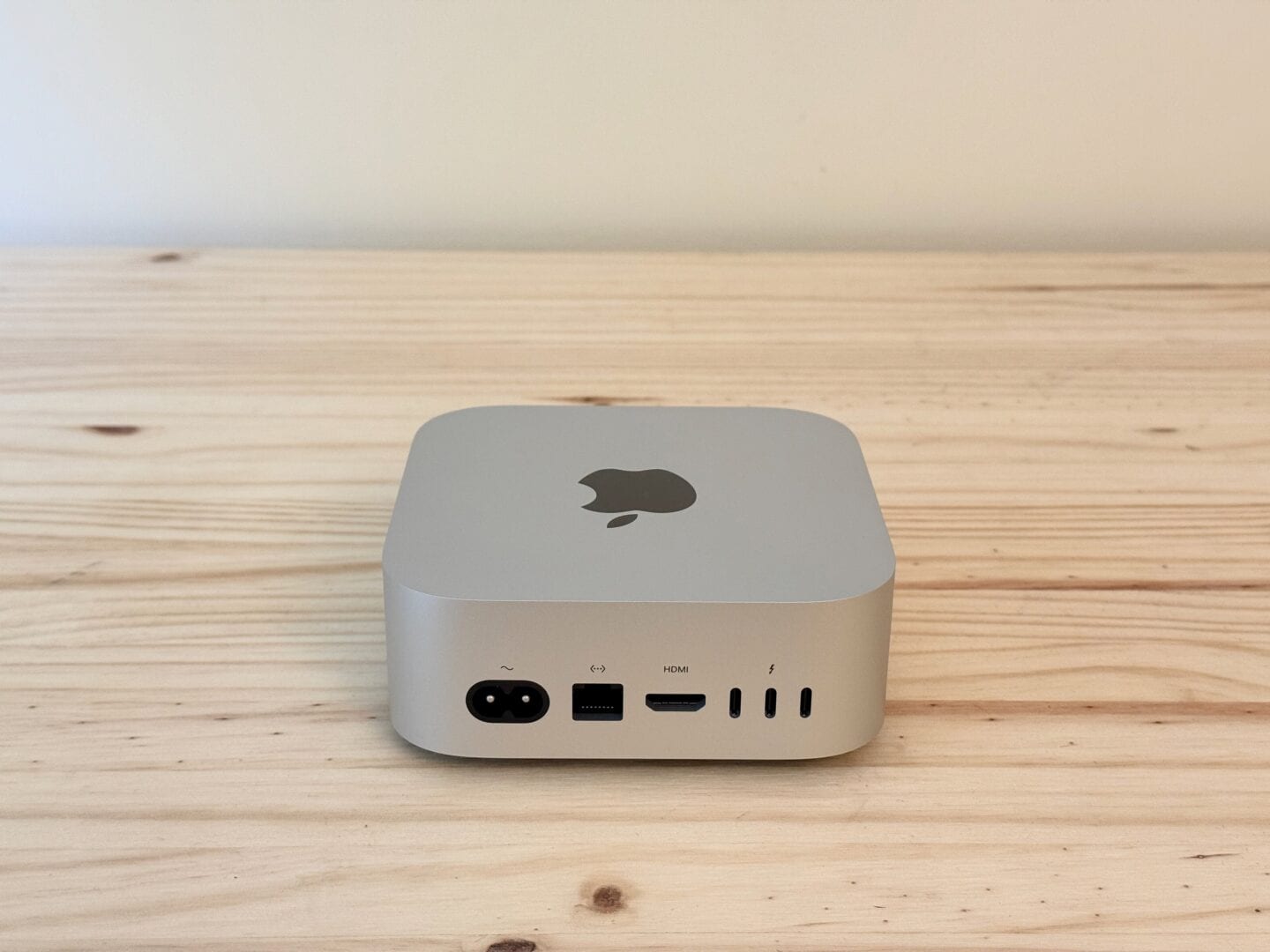 Mac mini M4 rear ports Mac mini M4 pictured from the rear, on a table