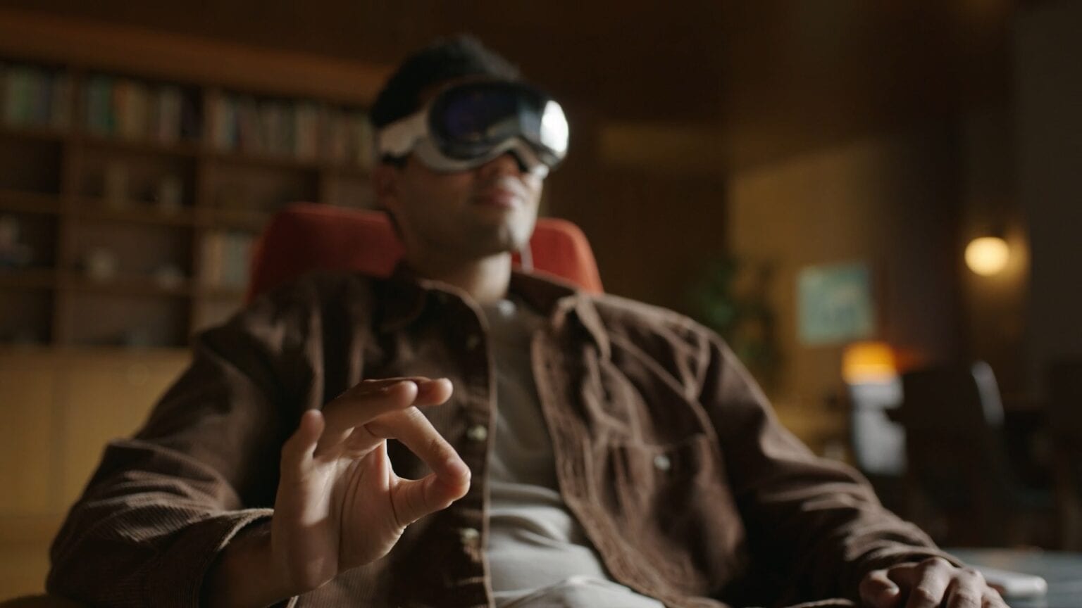 Man wearing Vision Pro tapping his fingers together